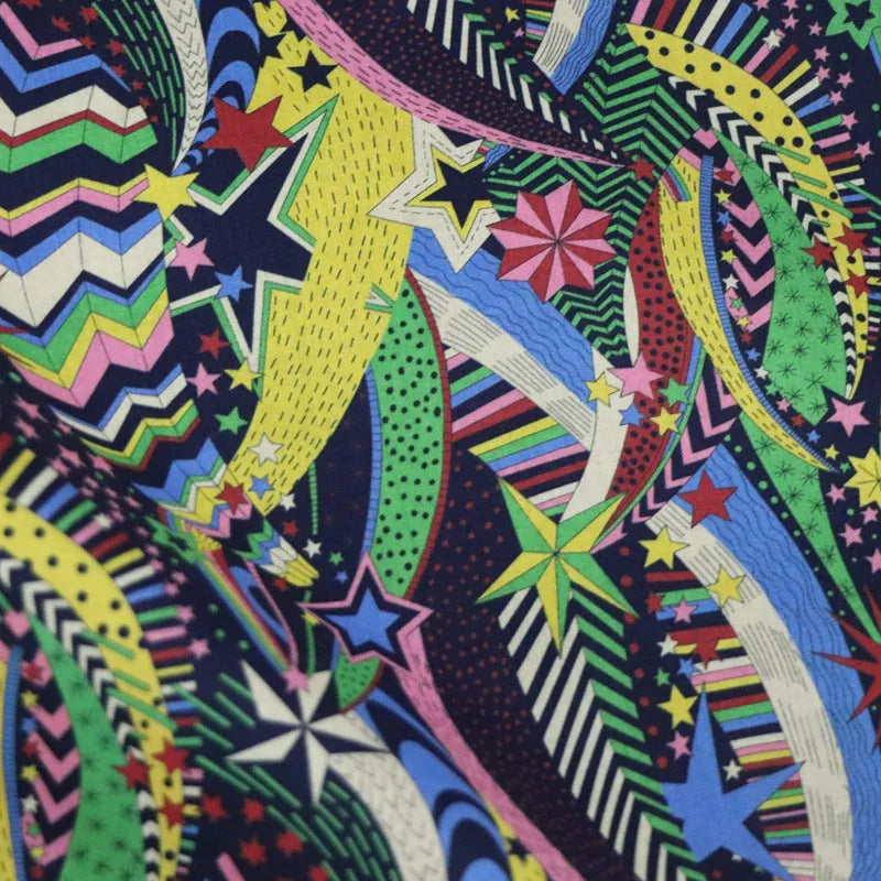 Blue cotton fabric with digitally printed plant and flower design showing 145cm width