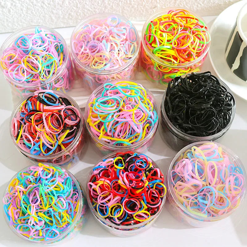 TPU baby hair ties in multiple colours stored in reusable container