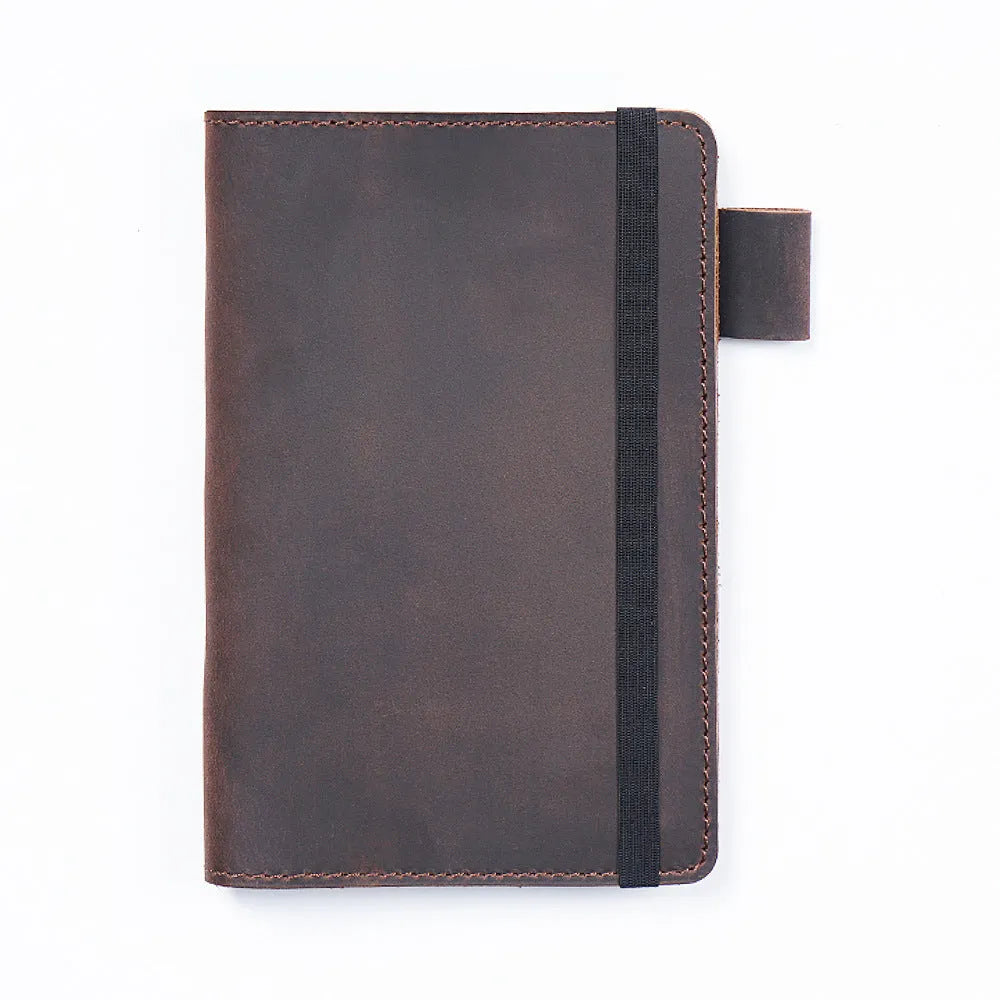 Handmade kraft notebook with a cowhide leather cover, shown open on wood-free paper.