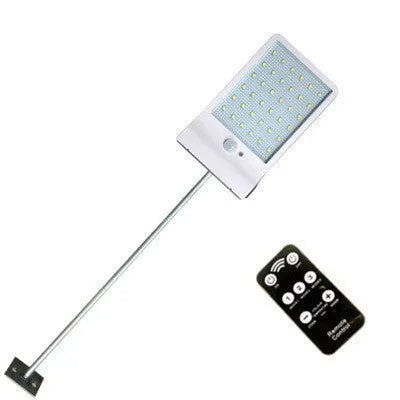 Black and white outdoor solar garden light with solar panel and IP65 waterproof rating.