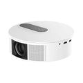 White HD home projector with remote control on a wooden table