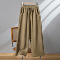 Women's straight leg casual trousers with a drawstring elastic waist in apricot colour.