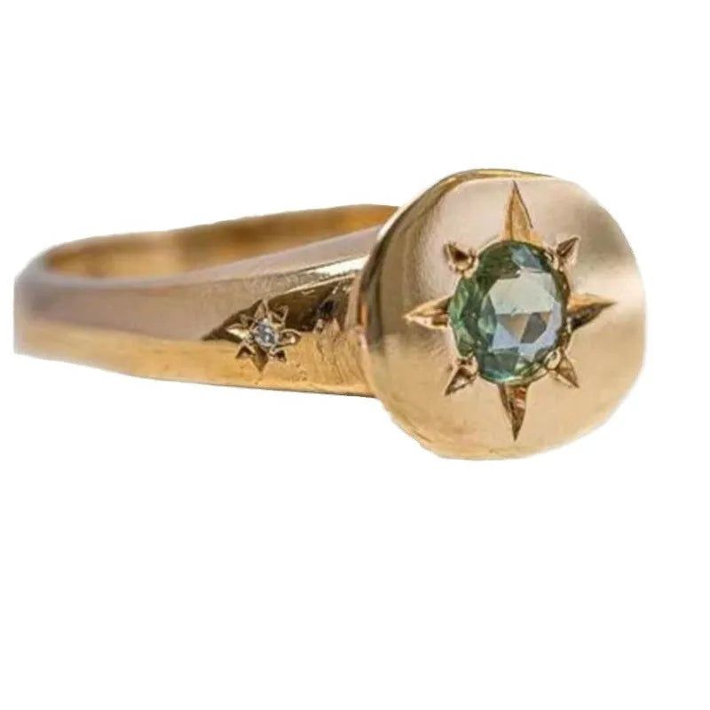 Golden star-shaped ring with oval zircon detailing and adjustable opening