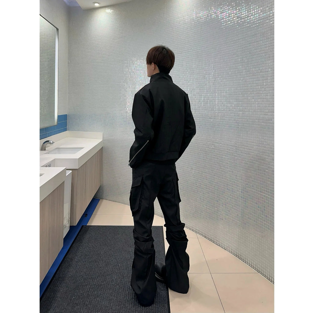Men's black cargo trousers with large side pockets, straight-leg cut, on a plain background