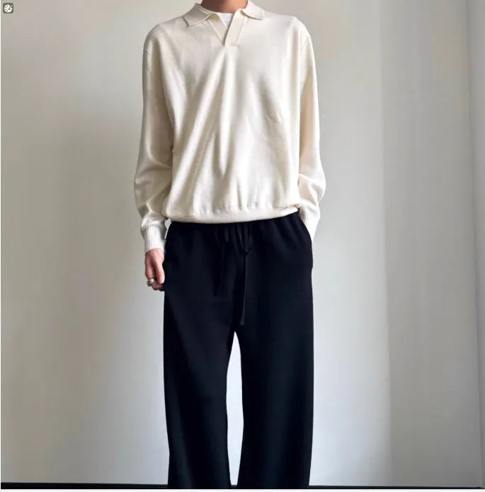 Men's pure wool polo sweater with lapel collar in milky white colour showing loose fit and long sleeves