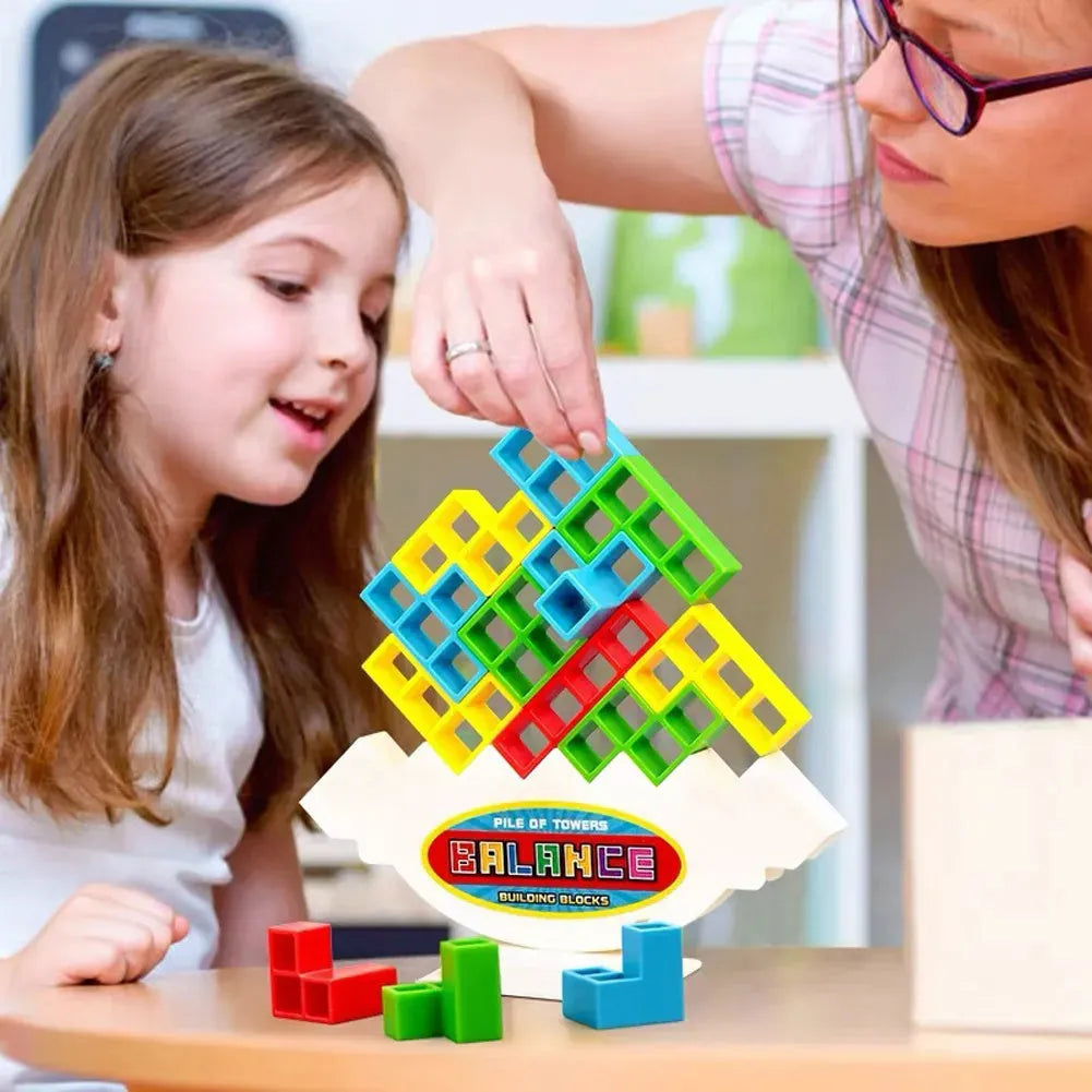 Balance stacking board game with plastic building blocks, chassis, and base for family play