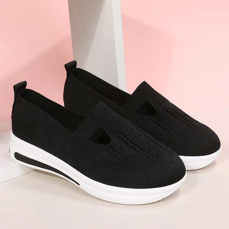 Flat platform wedge casual sneakers with mesh upper, round toe, and rubber sole in black, blue, and pink colours