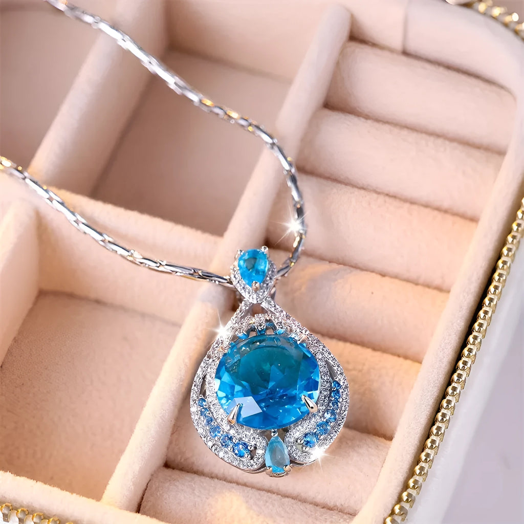 Blue geometric crystal necklace with fireworks-cut pendant on water wave chain