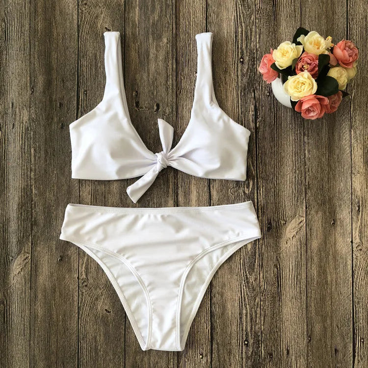 Solid colour bikini set on hanger, showing bra top and briefs in black, pink, red, white, or wine red.