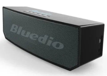 Black Bs-6 Bluetooth smart speaker on a desk showing its compact rectangular form.