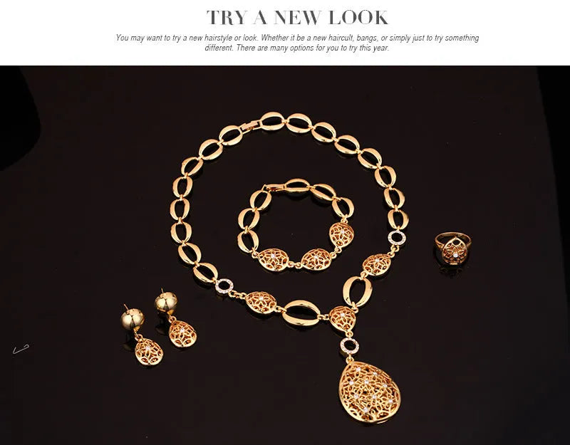 Gold alloy four piece jewellery set including necklace earrings bracelet and ring with bamboo link chain and love water drop bell patterns