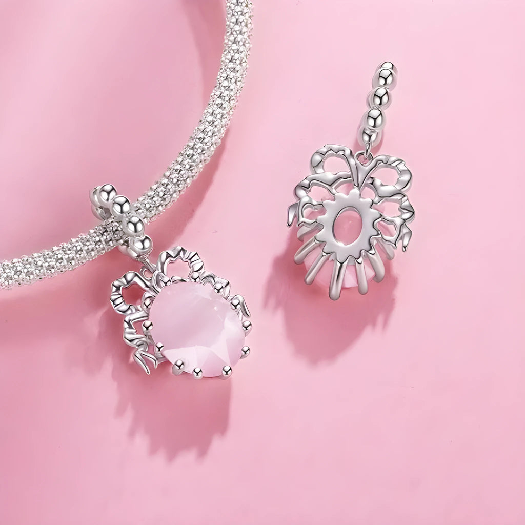 925 silver bow pendant with electroplated finish, height 2.4cm, width 1.2cm, on white background