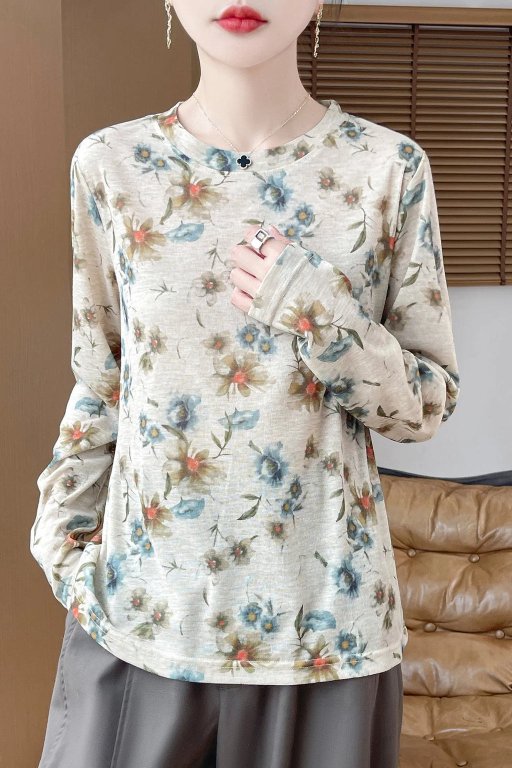 Women's round neck knit pullover shirt with artistic floral print in Tencel cotton fabric.