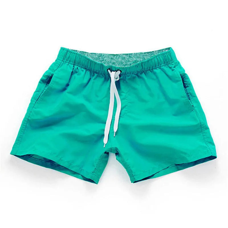 Men's straight leg beach shorts in polyester available in multiple colours and plus sizes.
