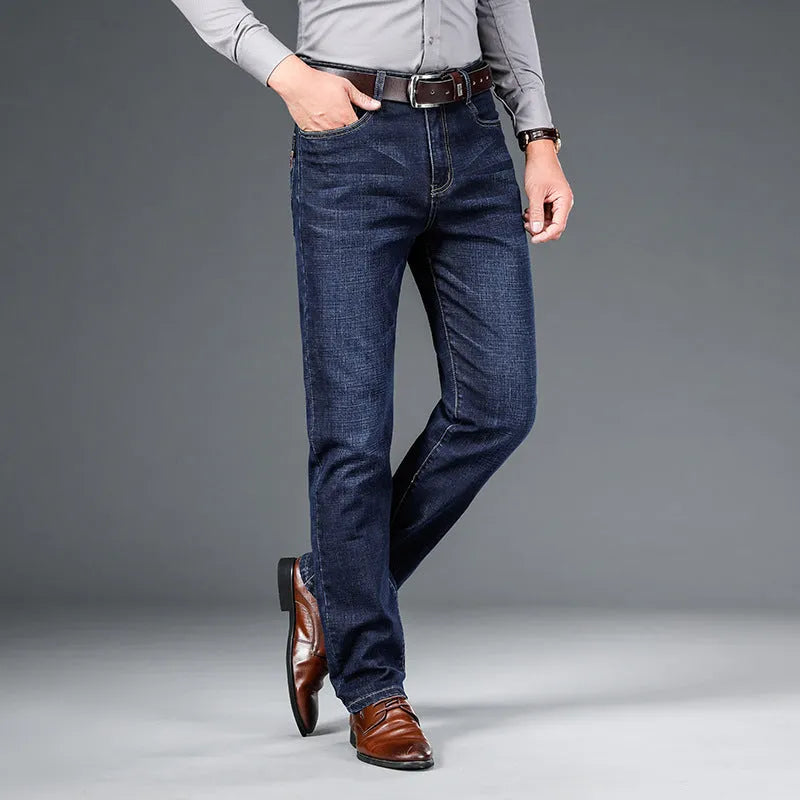 Men's straight loose elastic denim business trousers in dark blue colour, mid-waist straight-leg style on white background