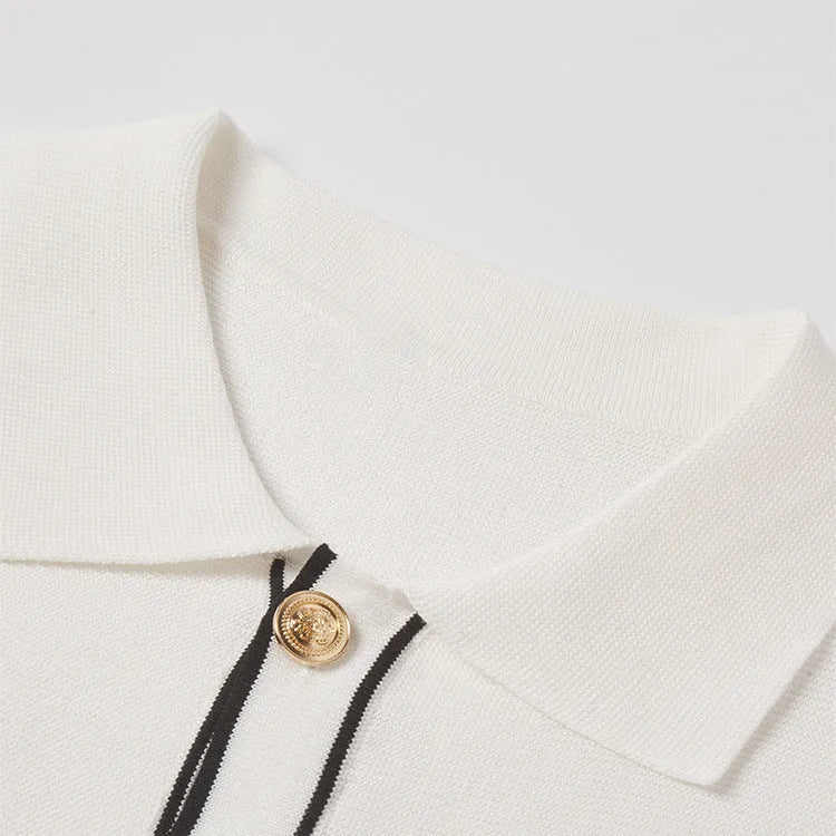 White short sleeve cardigan with contrast colour lapels on a hanger.