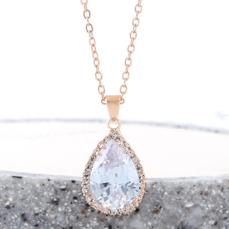 Women's geometric drop shape alloy necklace with rhinestone accents in rose gold pink colour