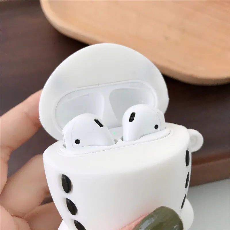 Silicone flip-cover protective case for AirPods 1 and 2 with airplane headset cartoon print and carry hook.