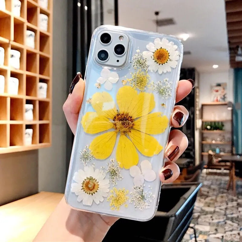 Pink and yellow floral patterned TPU iPhone case showing large flower design on back cover