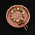 Carved bodhi root and white jade pumpkin lotus beads bracelet with cat's paw pendant.