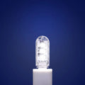Small white USB-powered LED baby night light showing white and warm light options.