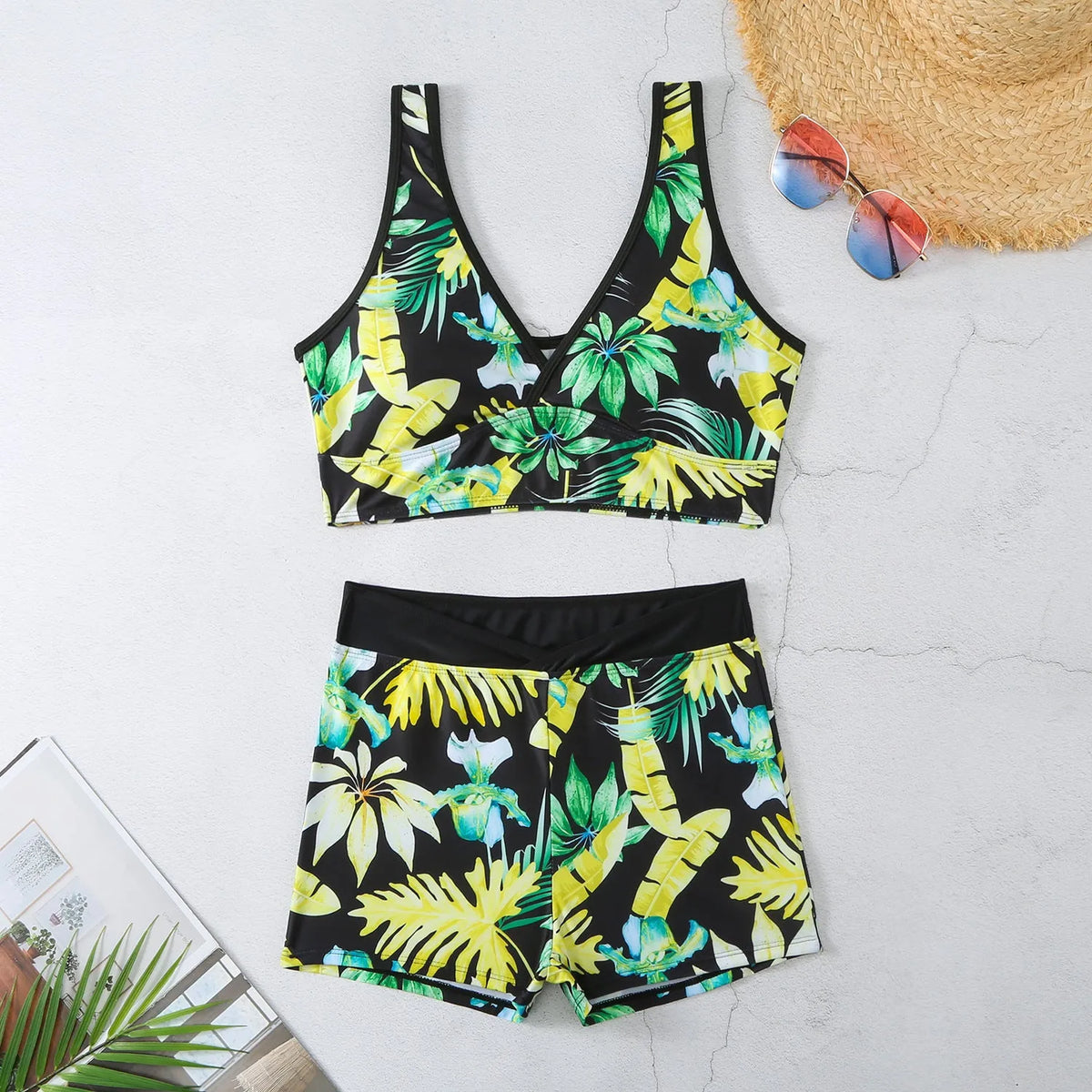 Women's two-piece swimsuit with sleeveless top and printed boxer briefs in multi-colour pattern