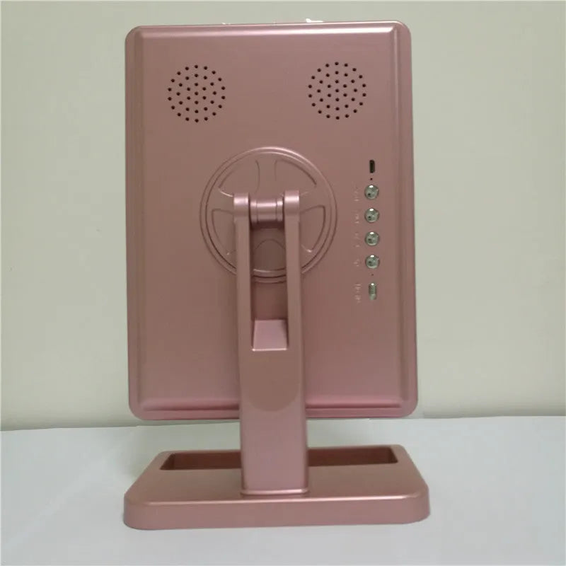 Touch screen makeup mirror with 20 LED lights and Bluetooth speaker on a dressing table with pink finish