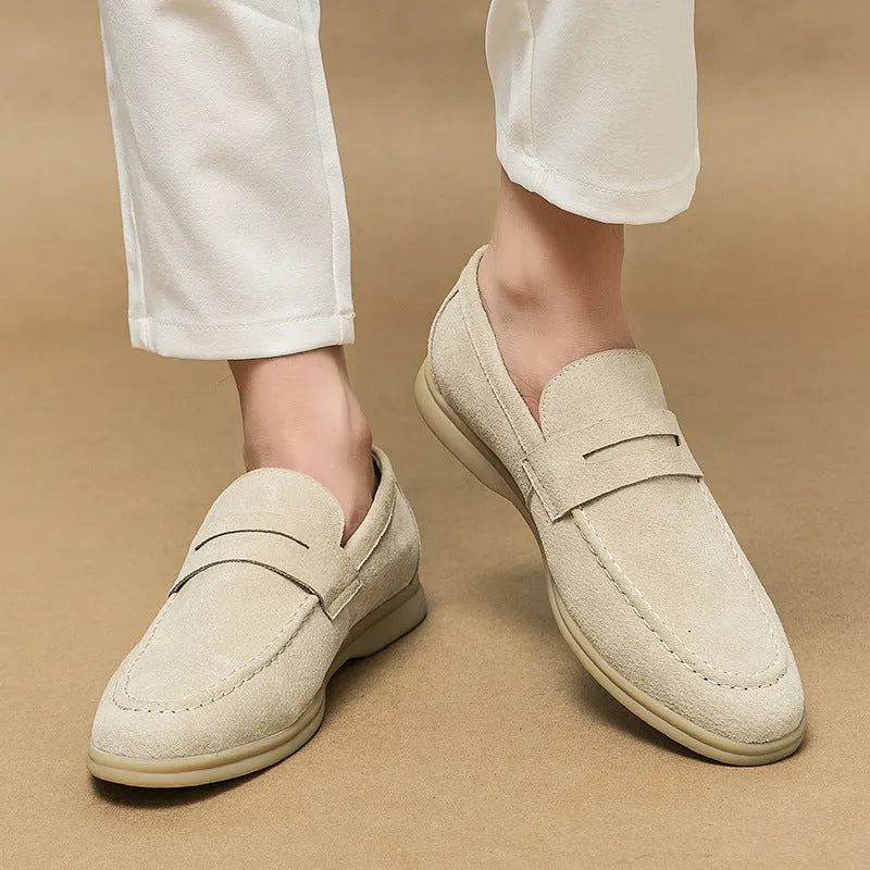 Men's beige leather slip-on casual shoes with a round toe and rubber sole on a white background