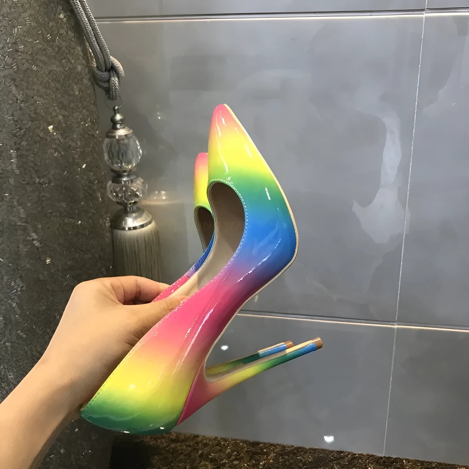 Rainbow multicolour patent leather women's stiletto heels with pointed toe on a white background