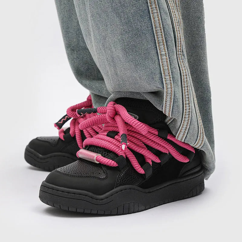 Thick bottom lace-up casual sneakers in denim blue with a round toe and flat rubber sole.