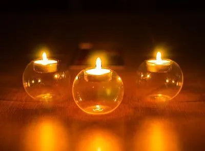 Clear round hollow glass candle holder handmade using hot glass frying table technique