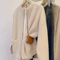 Beige viscose fibre soft wind sweater coat cardigan with long sleeves laid flat