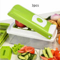 Green 12-piece manual vegetable chopper and food dicer set with stainless steel blades on a kitchen counter.