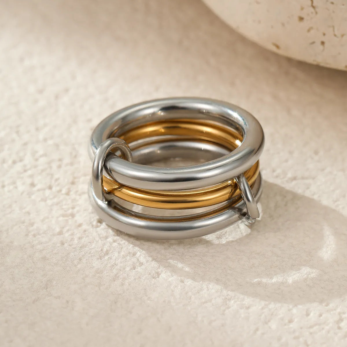 Stacked stainless steel ring set with 18K gold plating, exaggerated design for women.