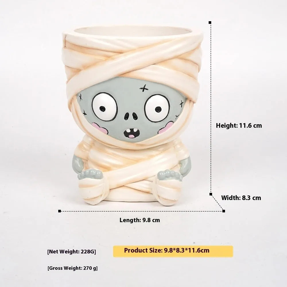 Four hand-painted Halloween cartoon resin flower pots showing bandage zombie, white ghost, Frankenstein, and death designs.