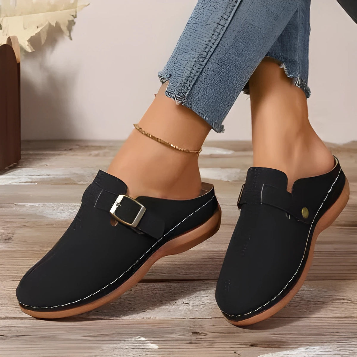 Women's casual wedge slipper in light brown with cloth upper and rubber sole.