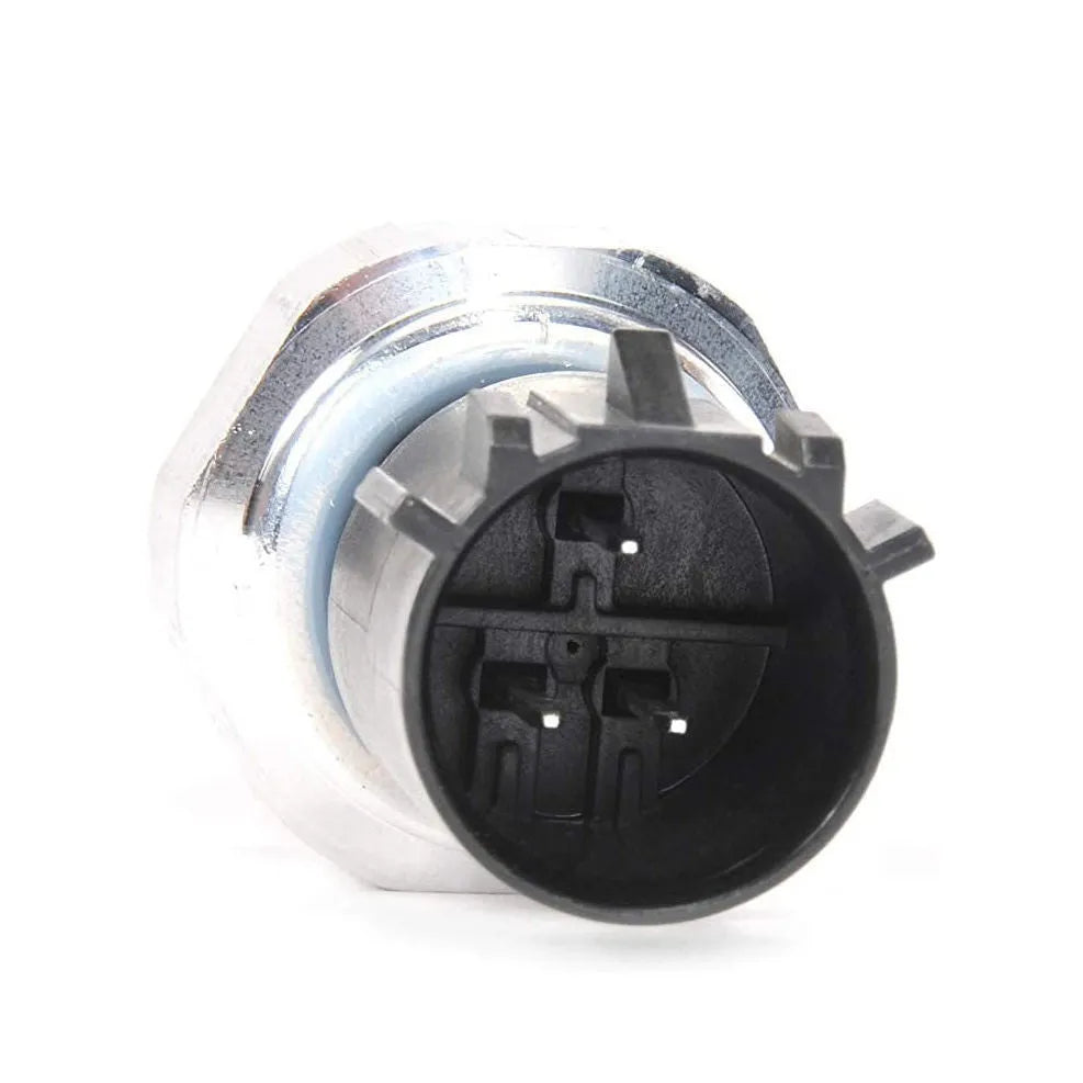Silver automobile fuel pressure sensor replacement part on a white background.