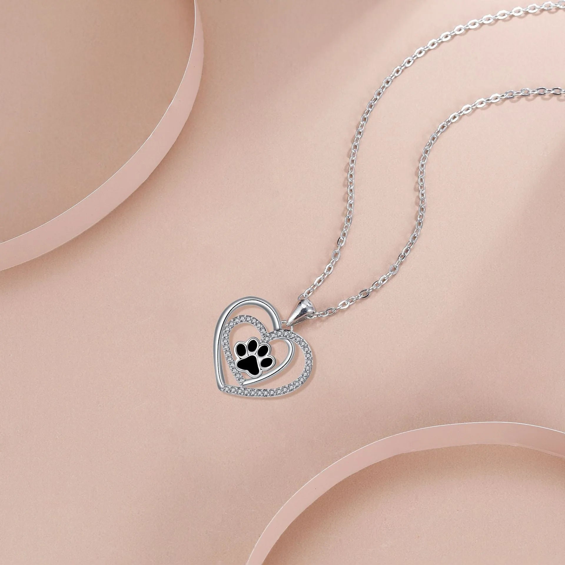 Dog's paw footprints necklace with heart pendant on cross chain