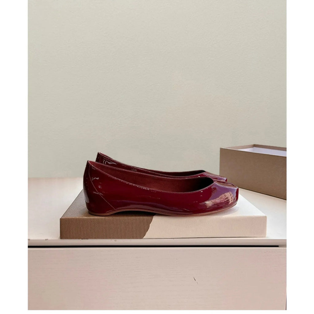Women's slip-on flat bottom split toe pumps in red with low heel and rubber sole