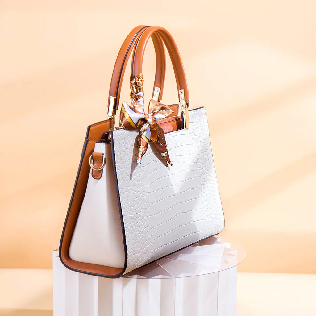 Milky white women's PU shoulder handbag with organised internal compartments on a plain background.