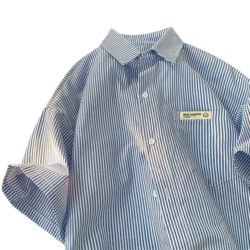 Blue striped plus size loose half sleeve shirt on hanger