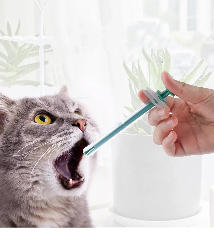 Two silicone pet pill shooter dispensers with soft tips for feeding medicine to cats and dogs