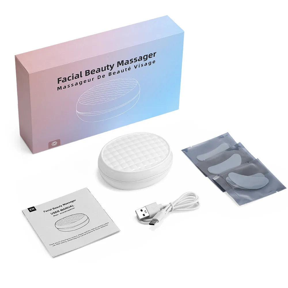 White wireless red light and EMS electric eye and facial massager device.