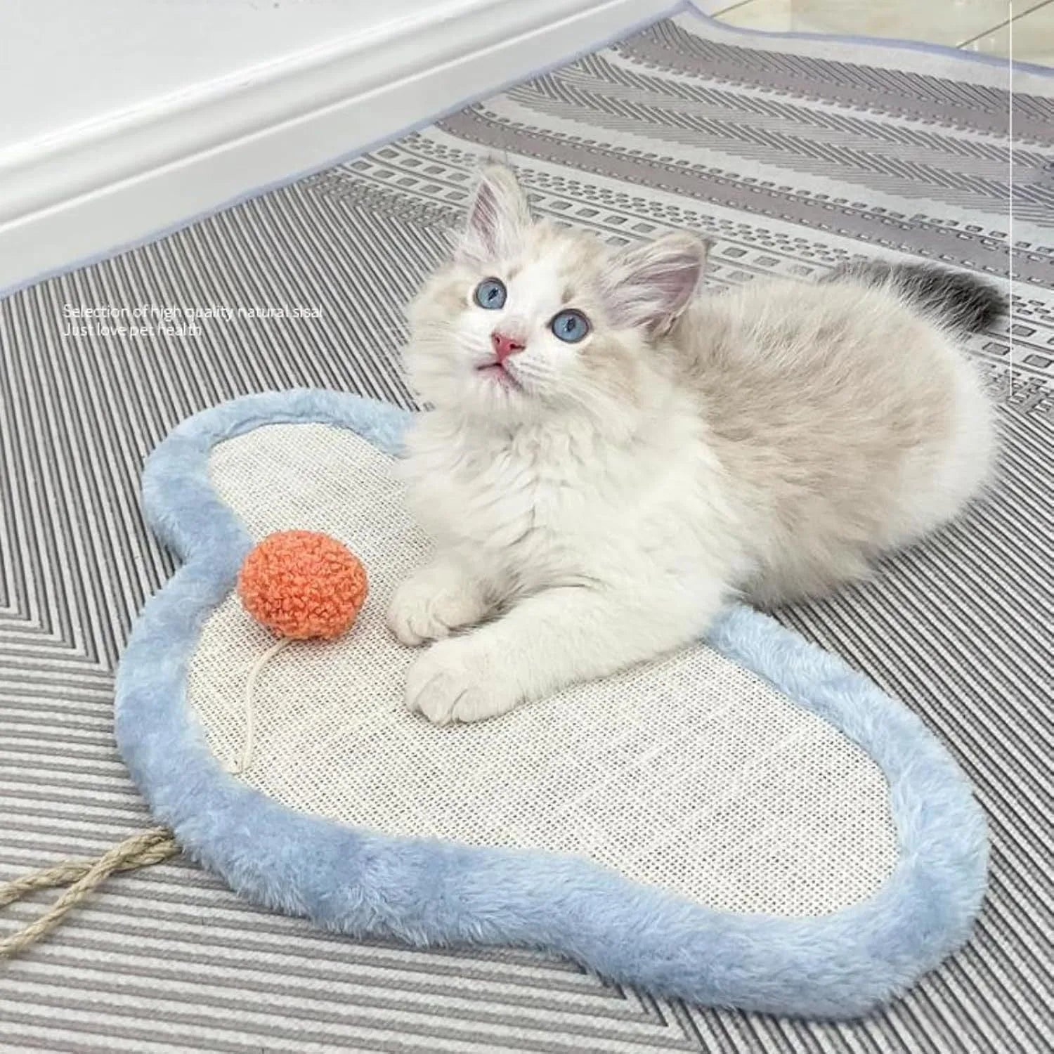 White cat scratching mat with sleeping cat design made from natural sisal material