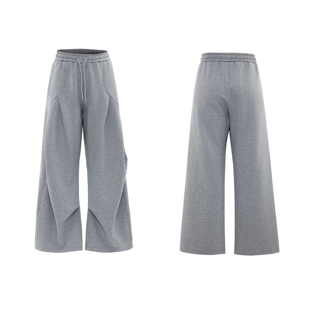 Men's dark grey cotton sports suit with V-neck short sleeve top featuring padded shoulders and metal embellishments with matching shorts