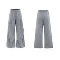 Men's dark grey cotton sports suit with V-neck short sleeve top featuring padded shoulders and metal embellishments with matching shorts