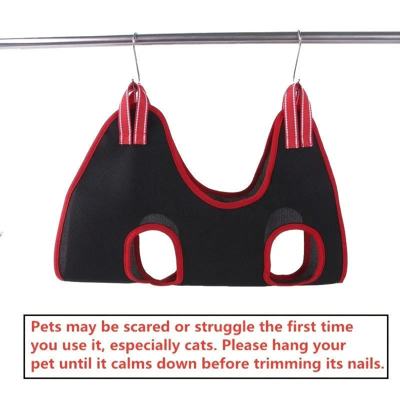 Mesh pet grooming restraint hammock bag shown in use for nail trimming a cat.
