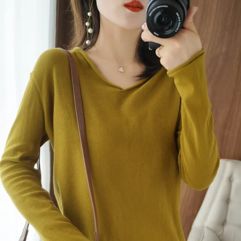 Women's grey V-neck long sleeve knitwear pullover on a hanger