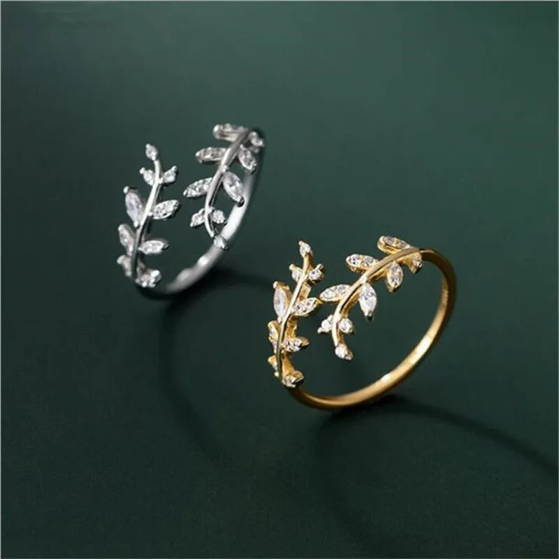 A leaf-shaped geometric copper ring with an electroplated silver or gold finish for women.