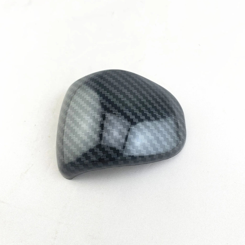 Car gear shift cover in carbon fibre pattern made from ABS plastic